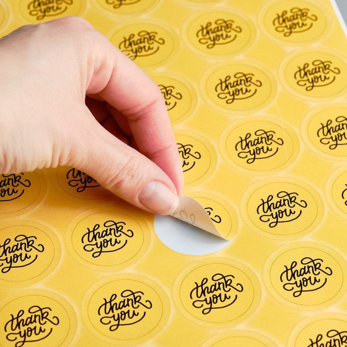 round sticker being peeled off the stickers sheet
